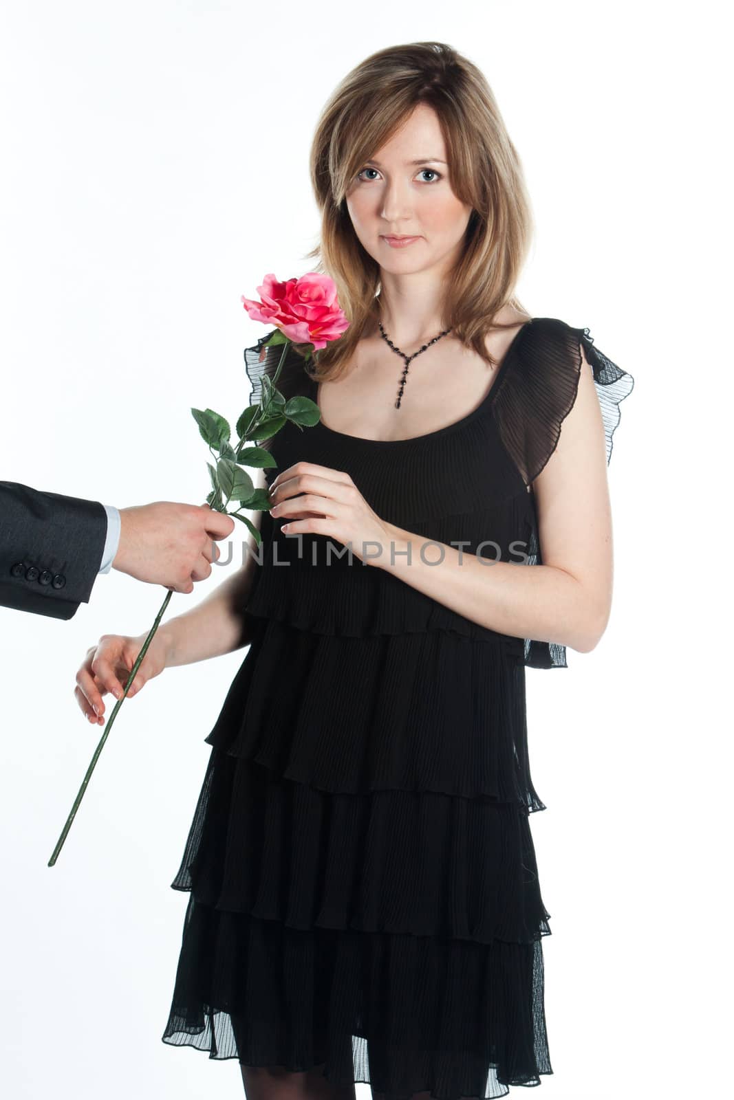 portrait of a young and beautiful girl with a gift and a rose