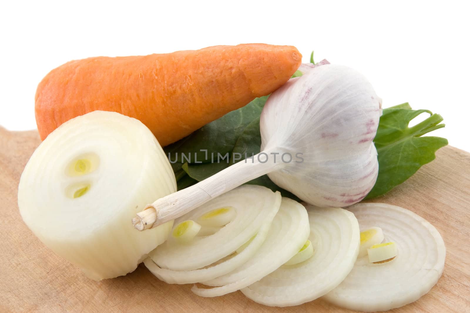 Onions, garlic, carrots and salad close up