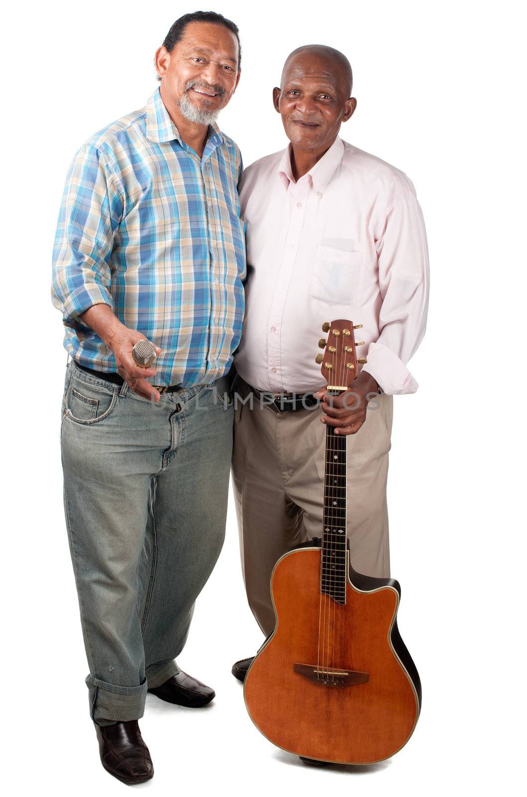 Two smiling old men pause for a moment with their guitar and microphone in rest mode.