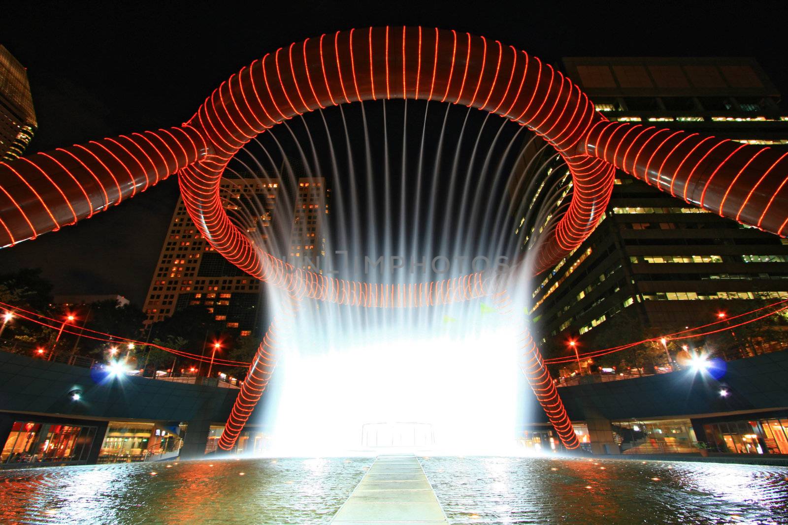 Fountain of Wealth in dusk , landmark of Singapore night