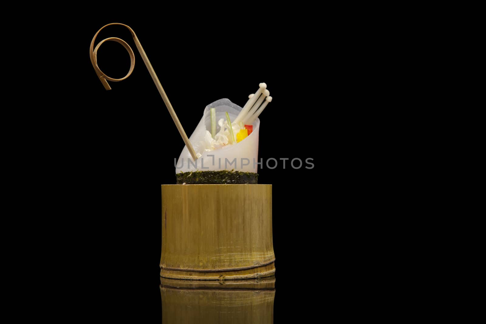 japanese food in bamboo pot on black background