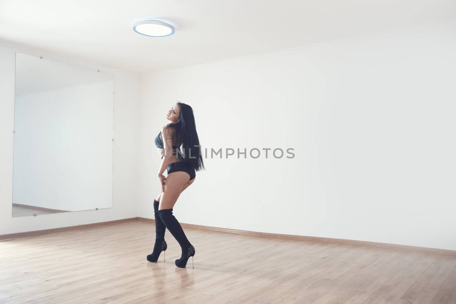 Woman performing seductive dance in ball room
