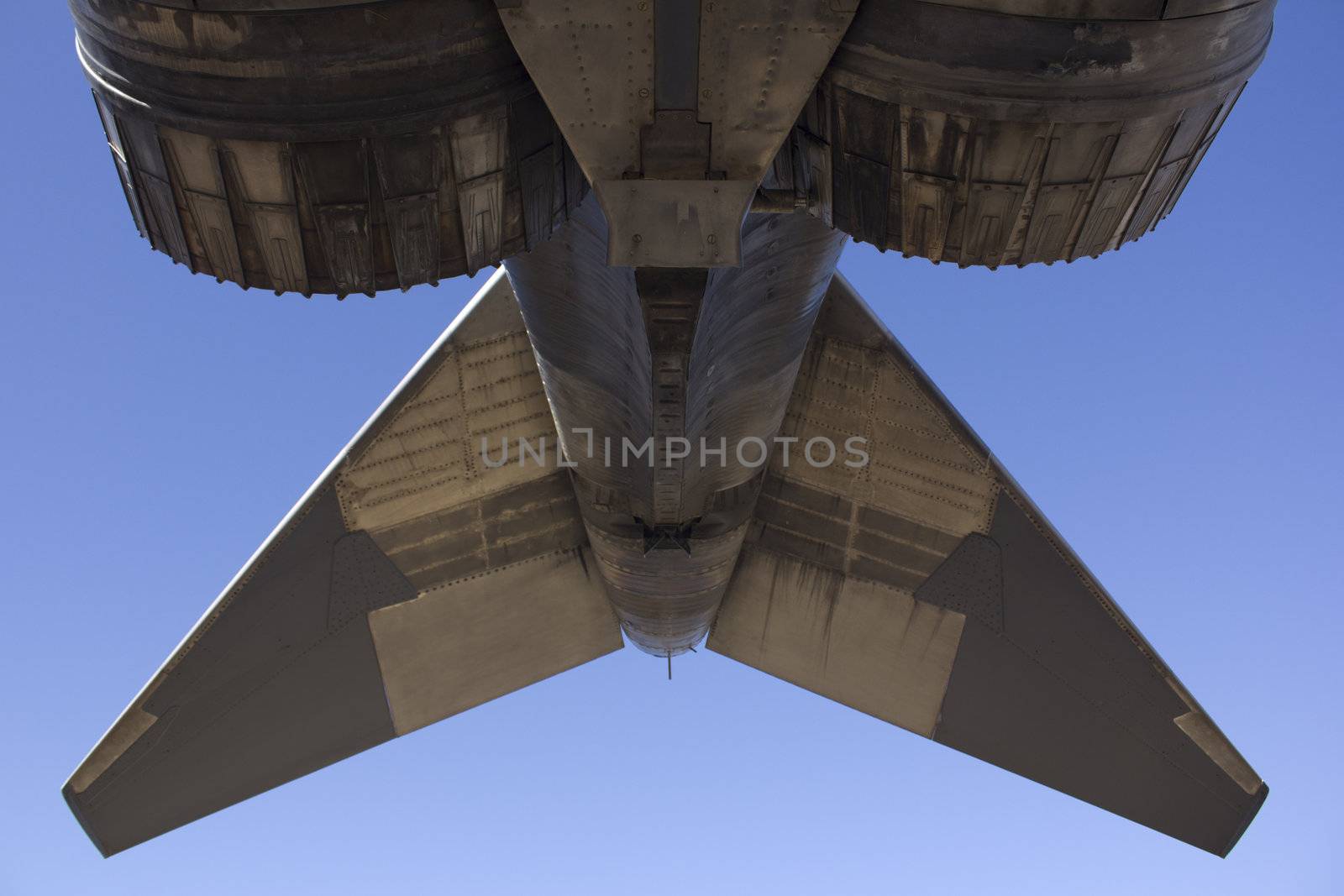 Tail of a military jet fighter plane by jeremywhat