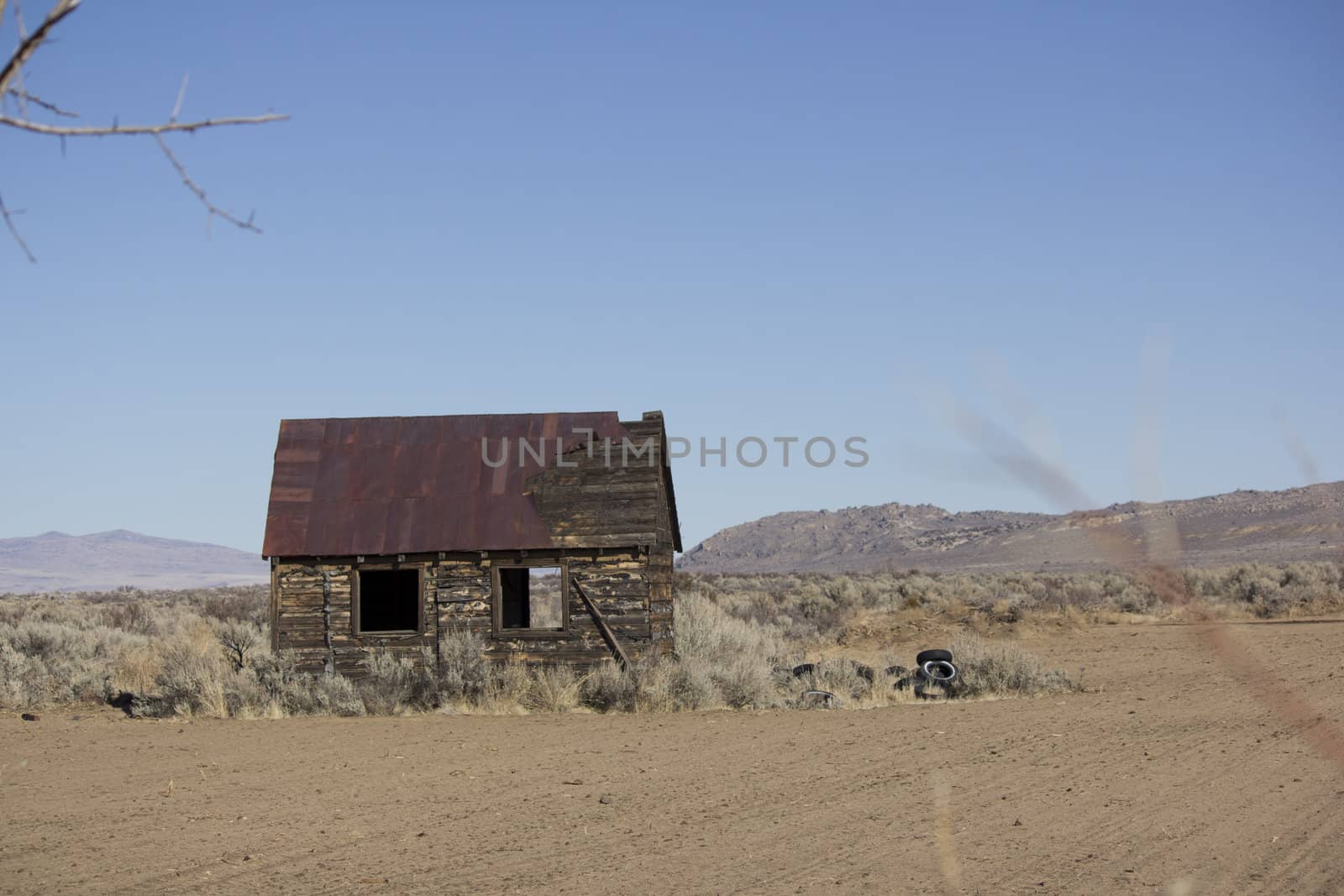 an old rusty shack in the desert.