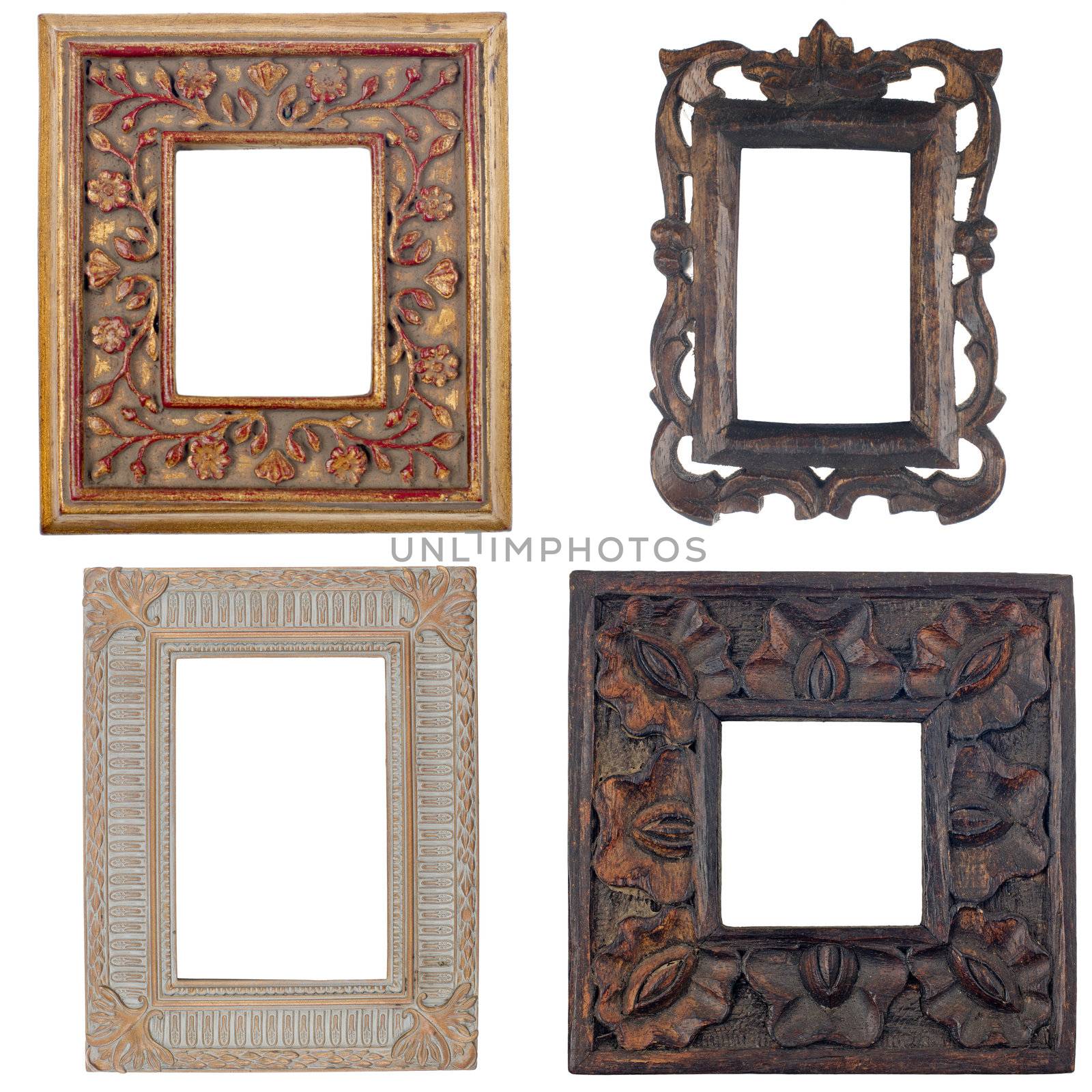 Four antique picture frames isolated on white background.