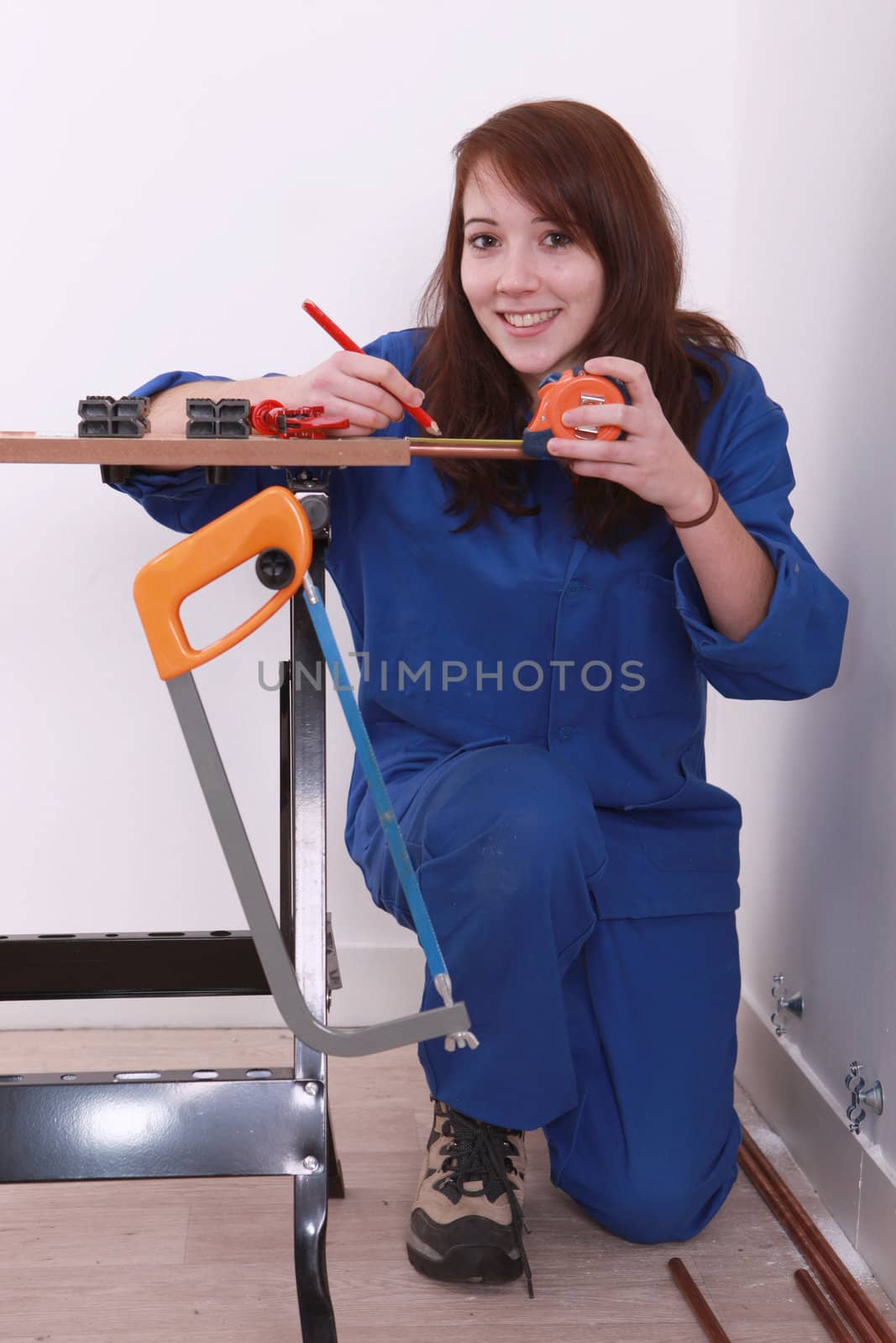 craftswoman taking measurements