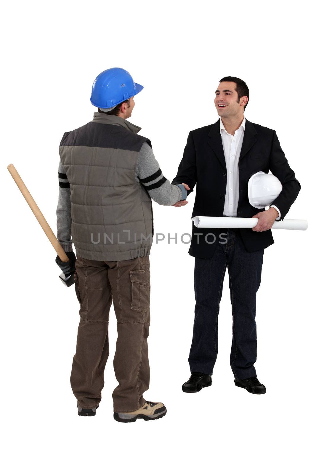 Architect shaking laborer's hand by phovoir
