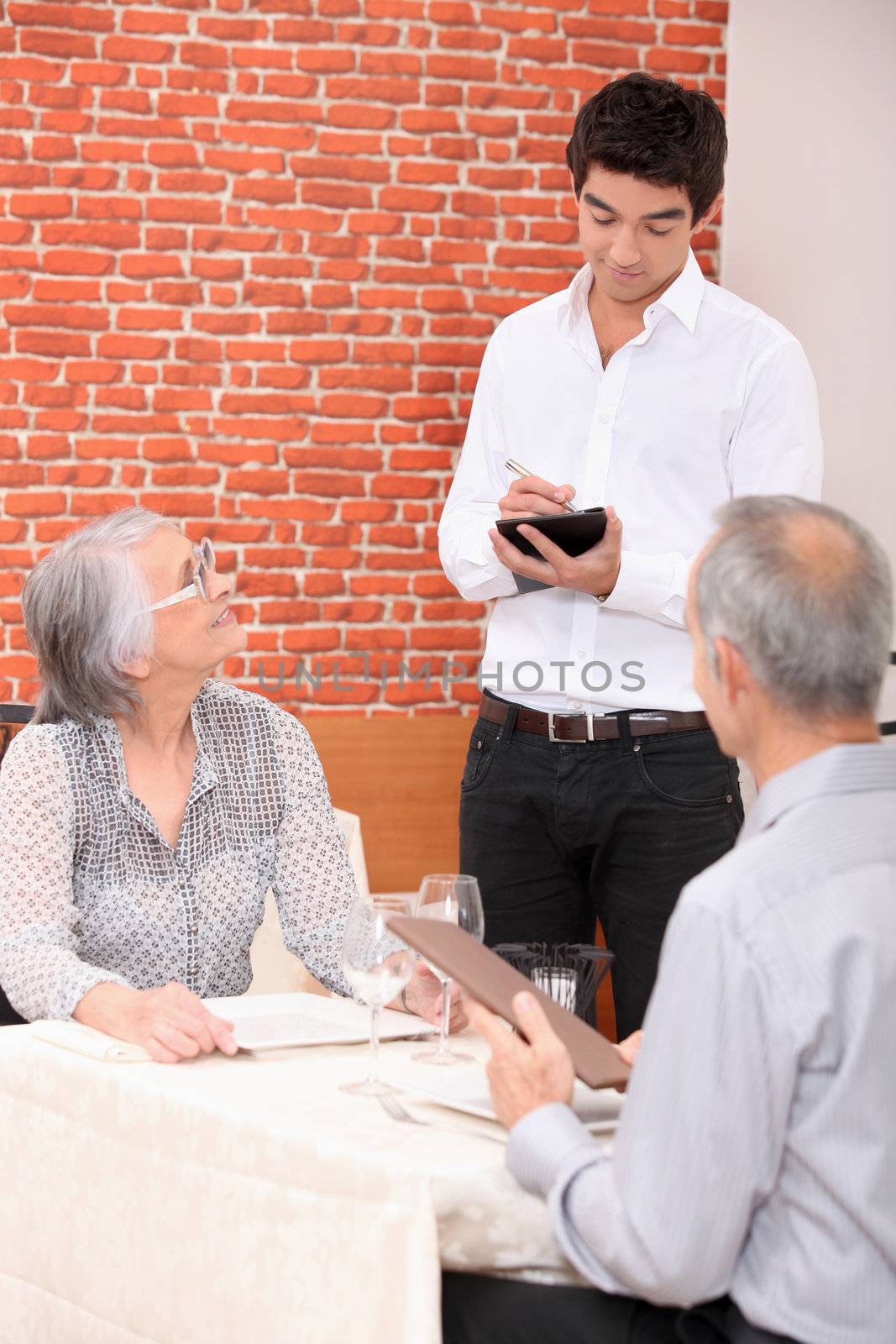 Waiter taking order in a restaurant