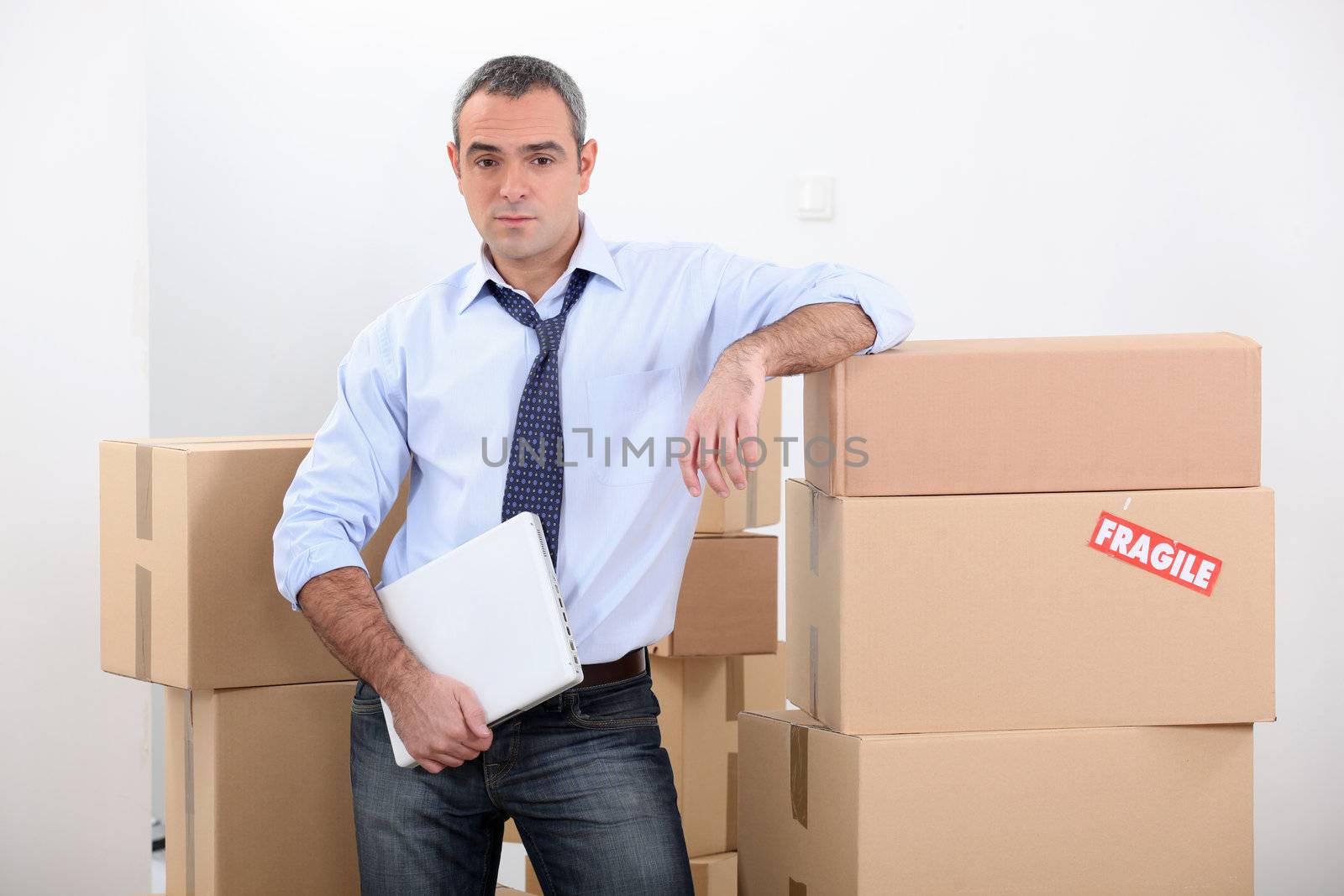 Man stood by stacked boxes