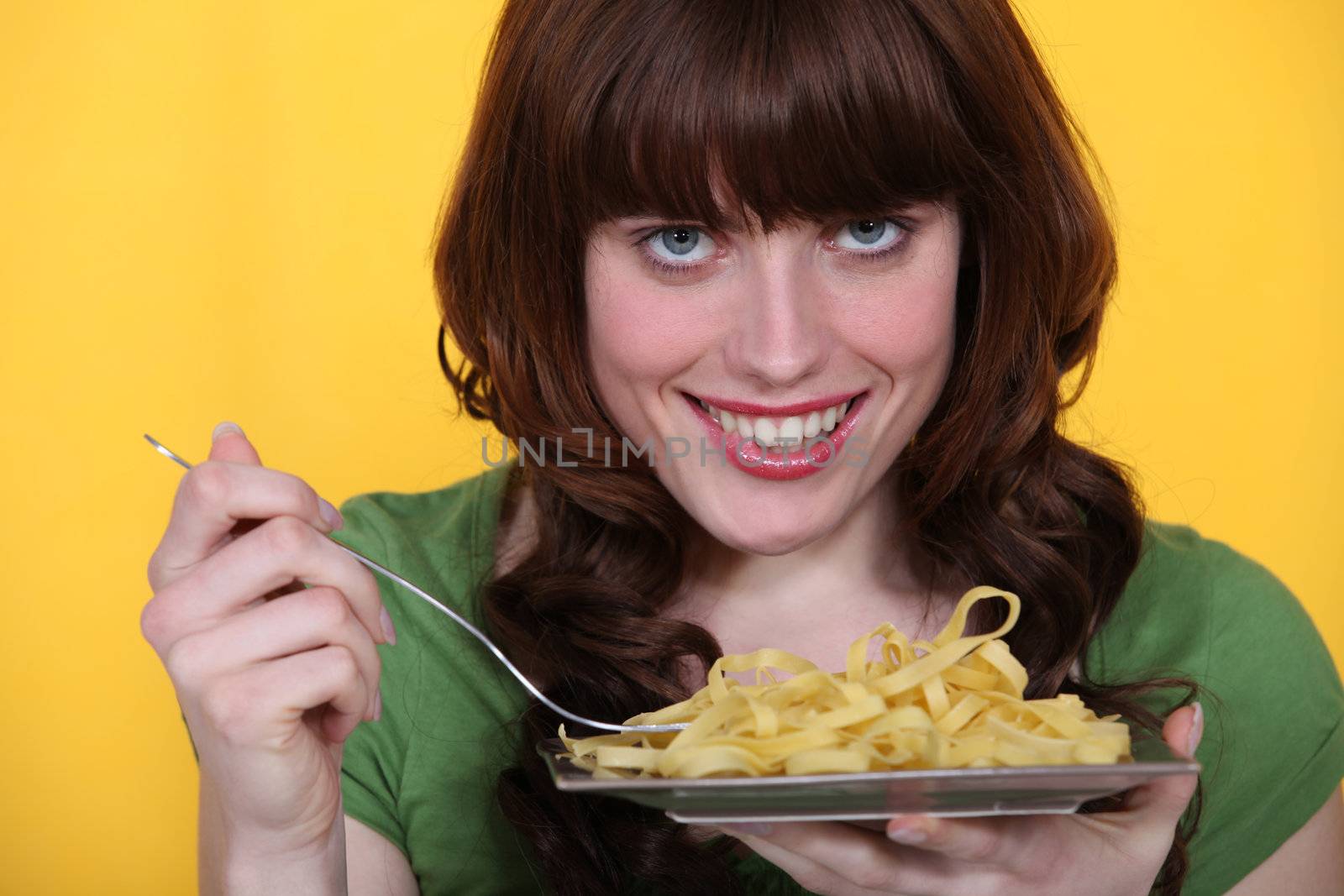 Woman eating tagliatelle