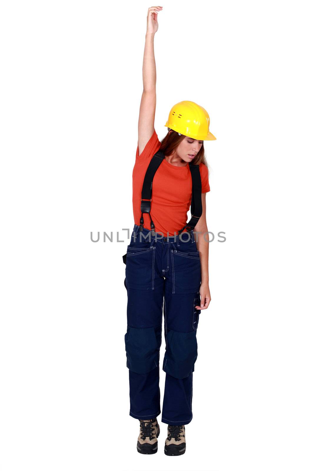Tradeswoman being pulled up by an invisible object