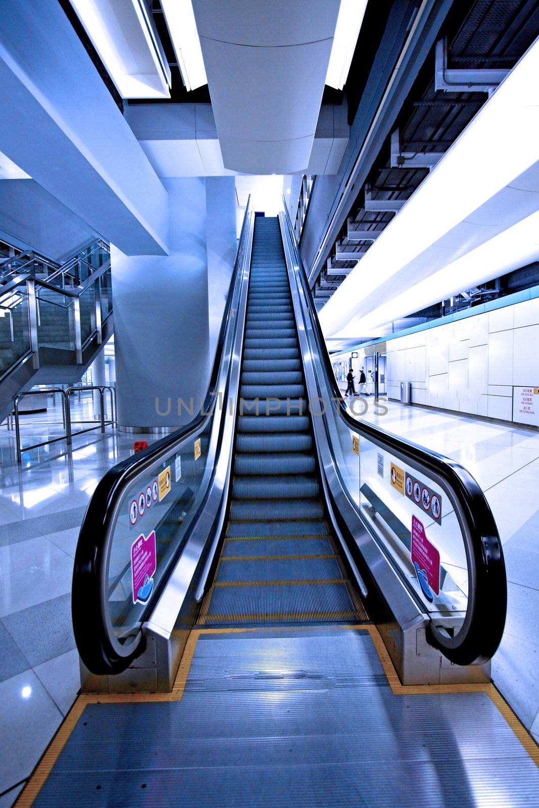 Moving escalator in a subway station by kawing921