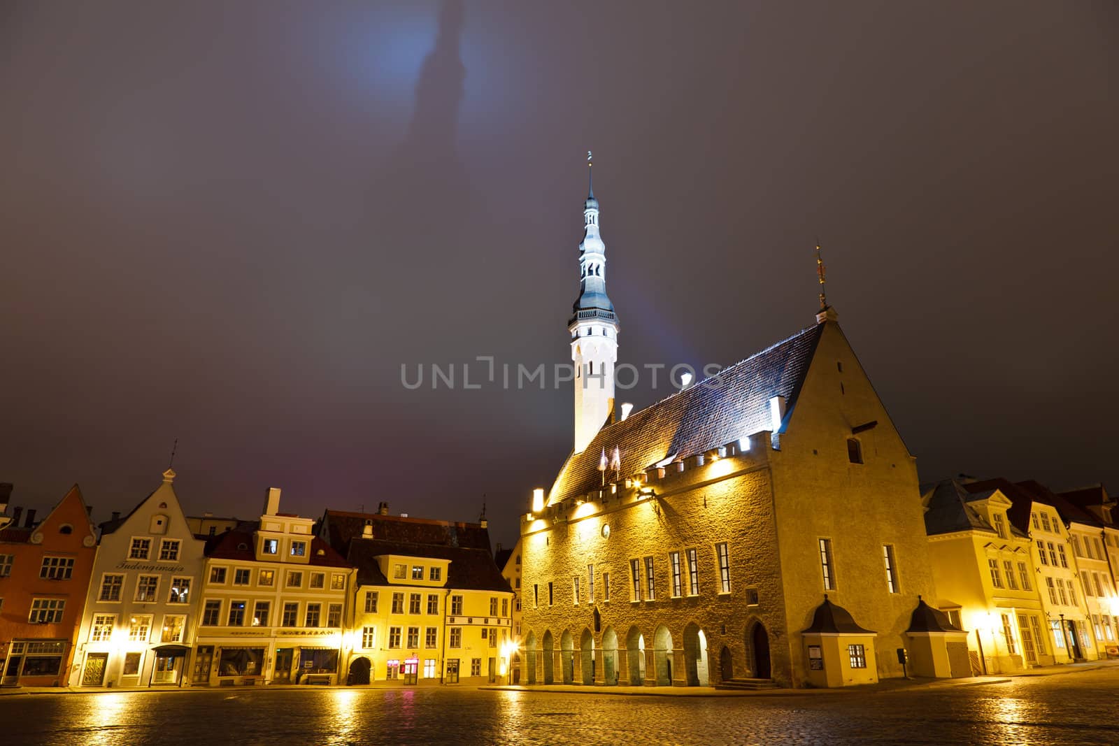 Tallinn Town Hall at Night Casting Shadow in the Sky, Estonia by anshar