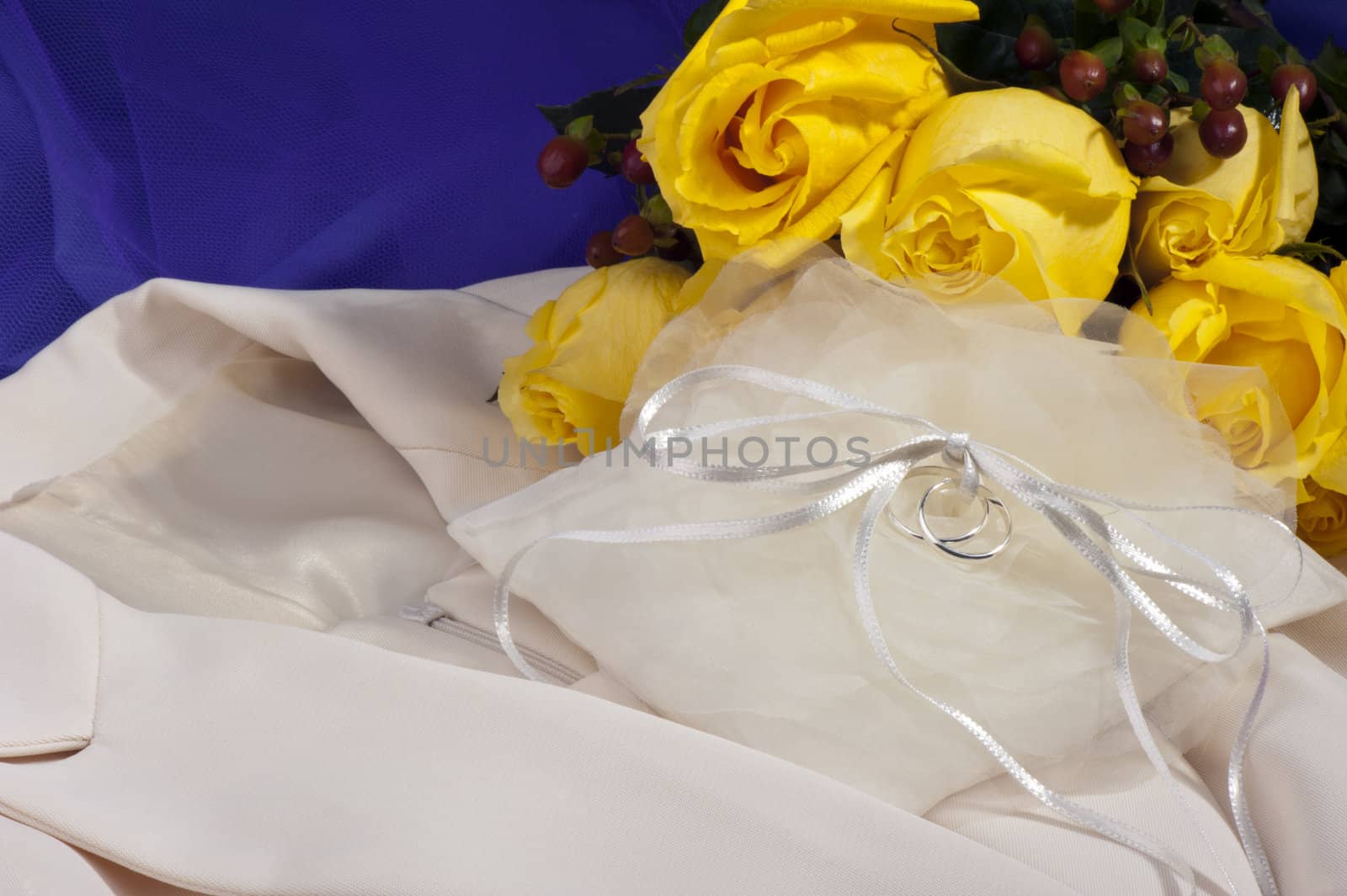 wedding ring ,wedding dress and yellow roses