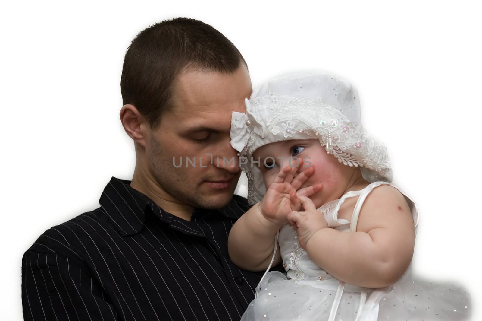 Young father holding his daughter in nice white dress