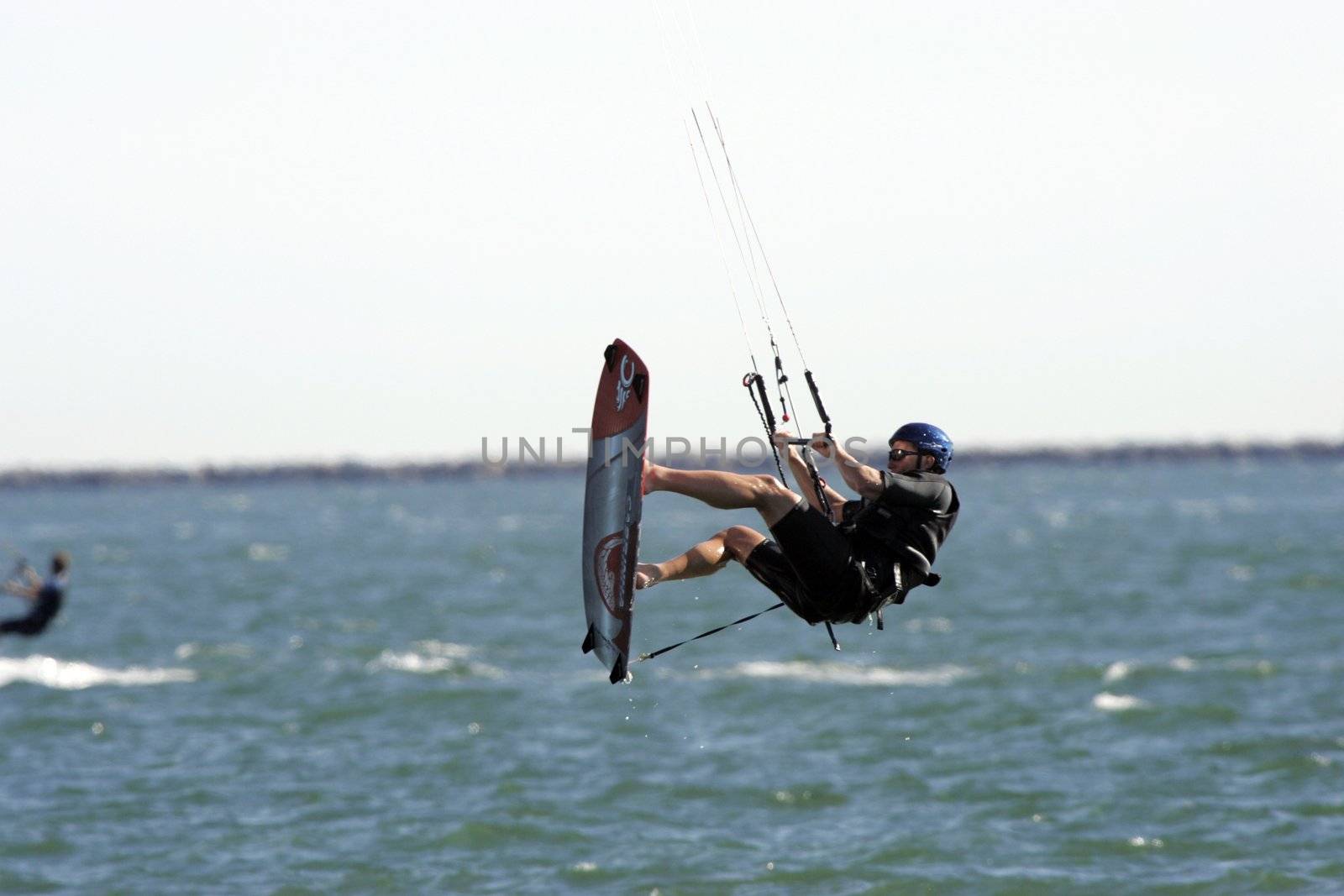 Kitesurfer jumps in the air