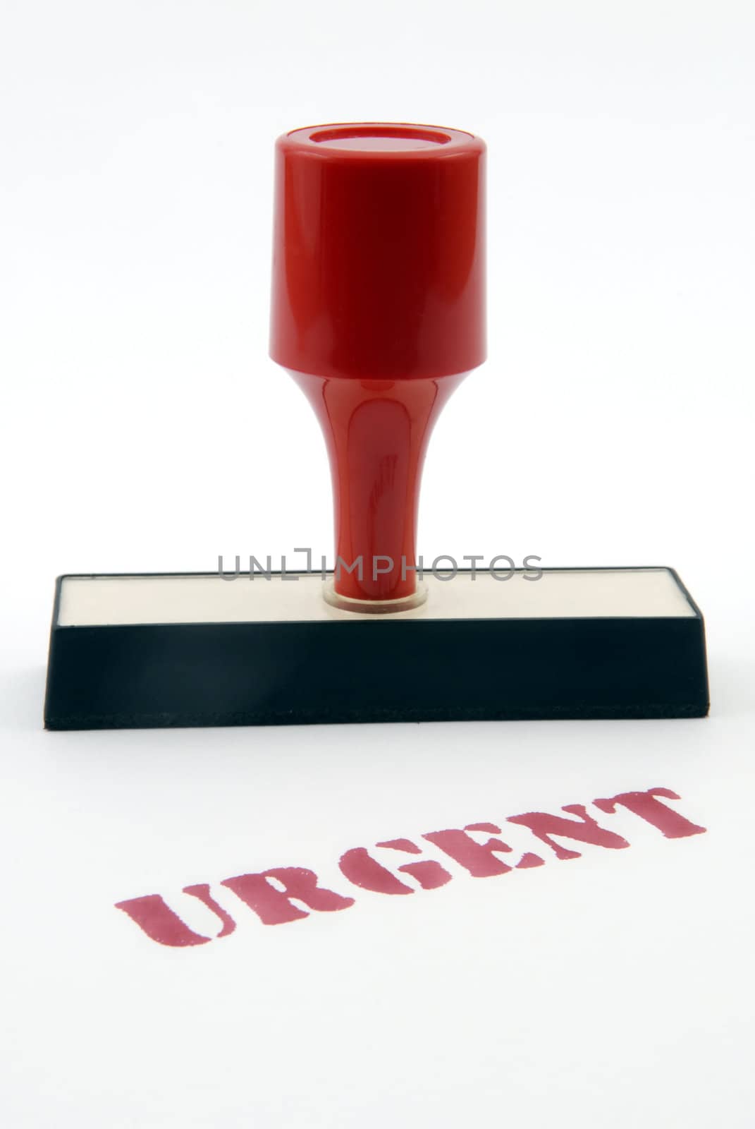 Urgent rubber stamp with red plastic handle