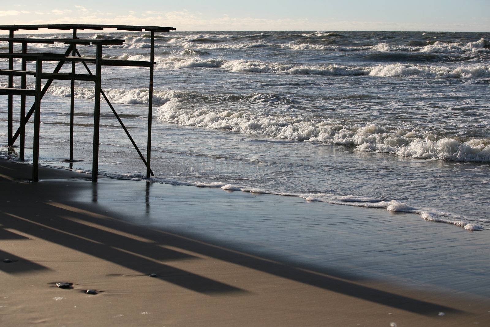 The image of a winter beach and the sea at the Baltic coast