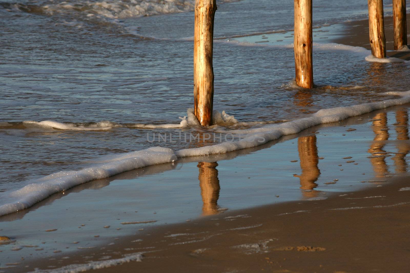 Beach with wooden strengthenings. Baltic sea