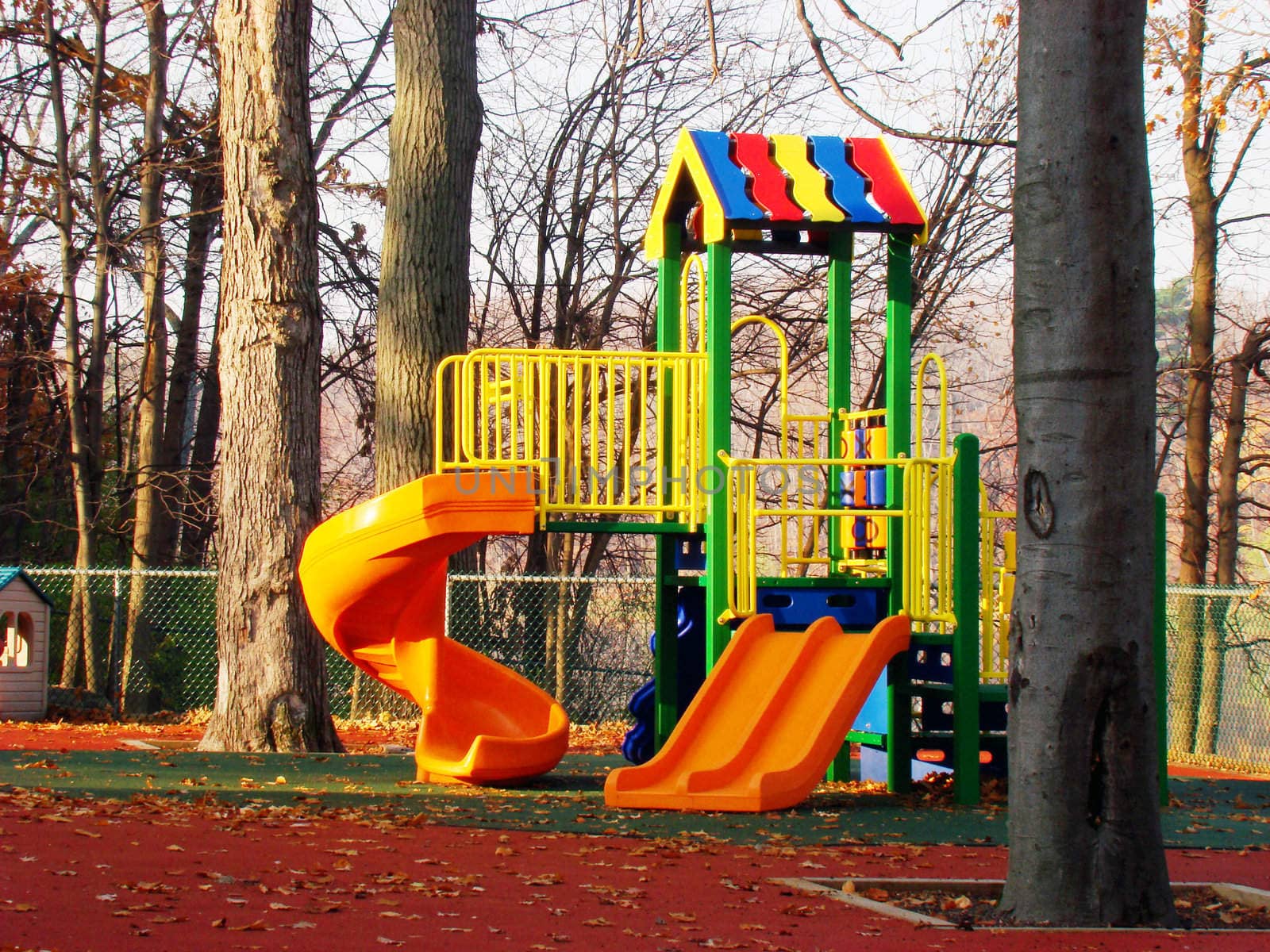 Children's playground exercise equipment, sunny fall morning.