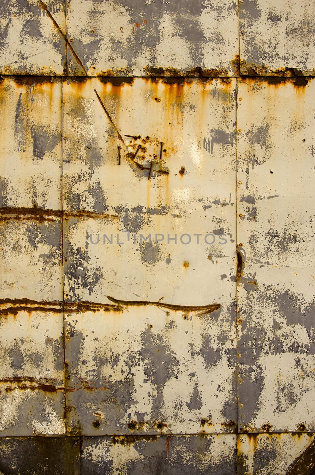 Rusty tin house wall closeup. Vintage retro background.