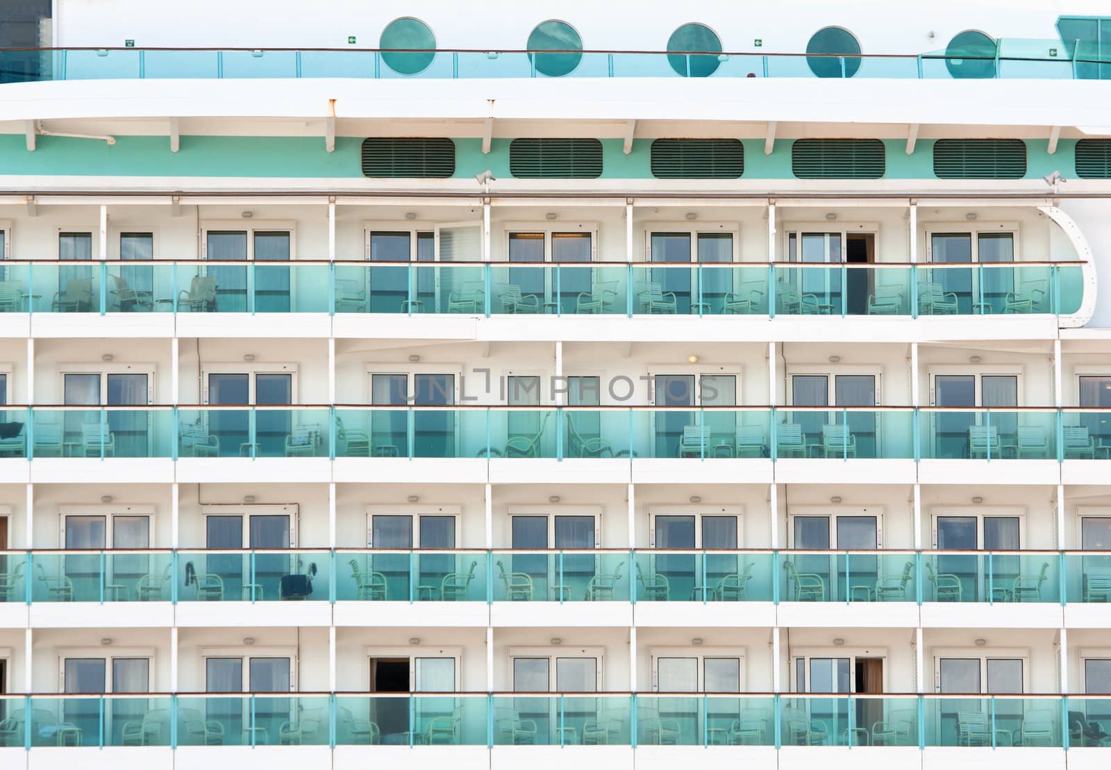 Closeup of cabin balconies of an ocean liner or cruise ship.