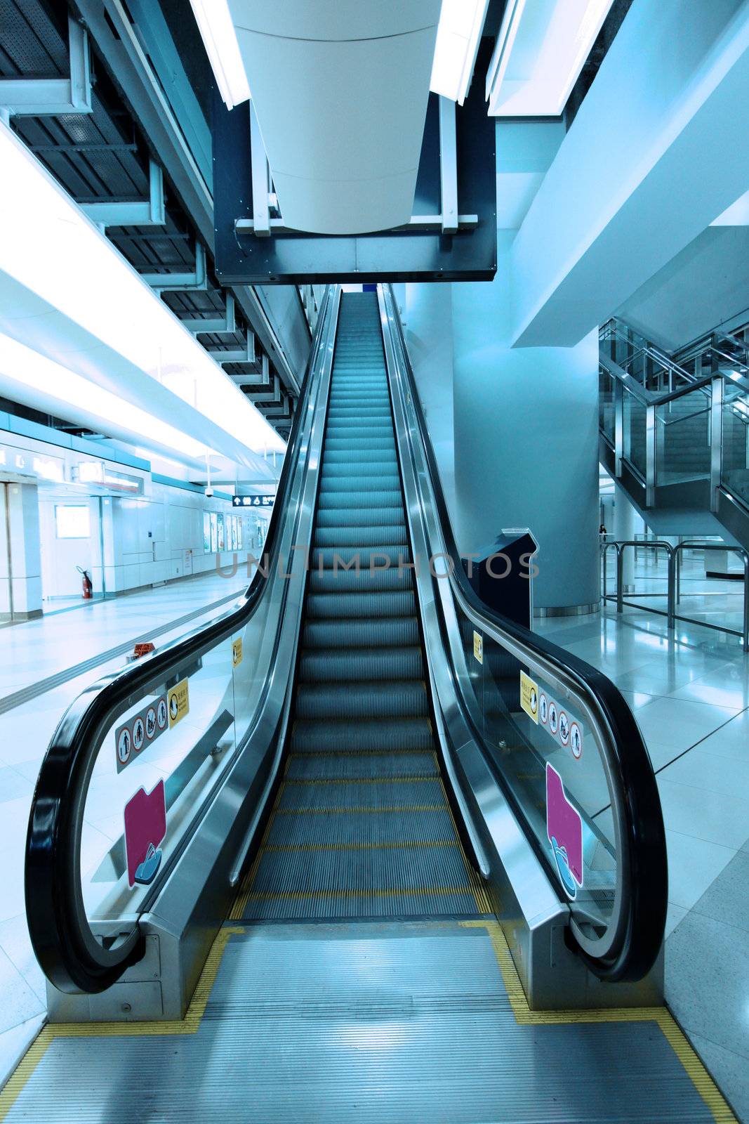 Moving escalator in subway station by kawing921