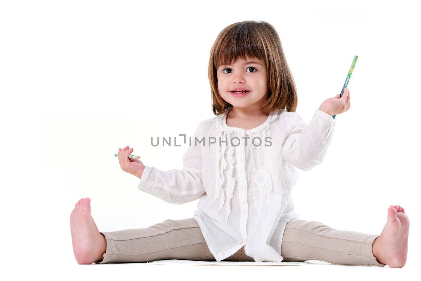 Portrait of cute little girl holding pencils. Isolated on white background.