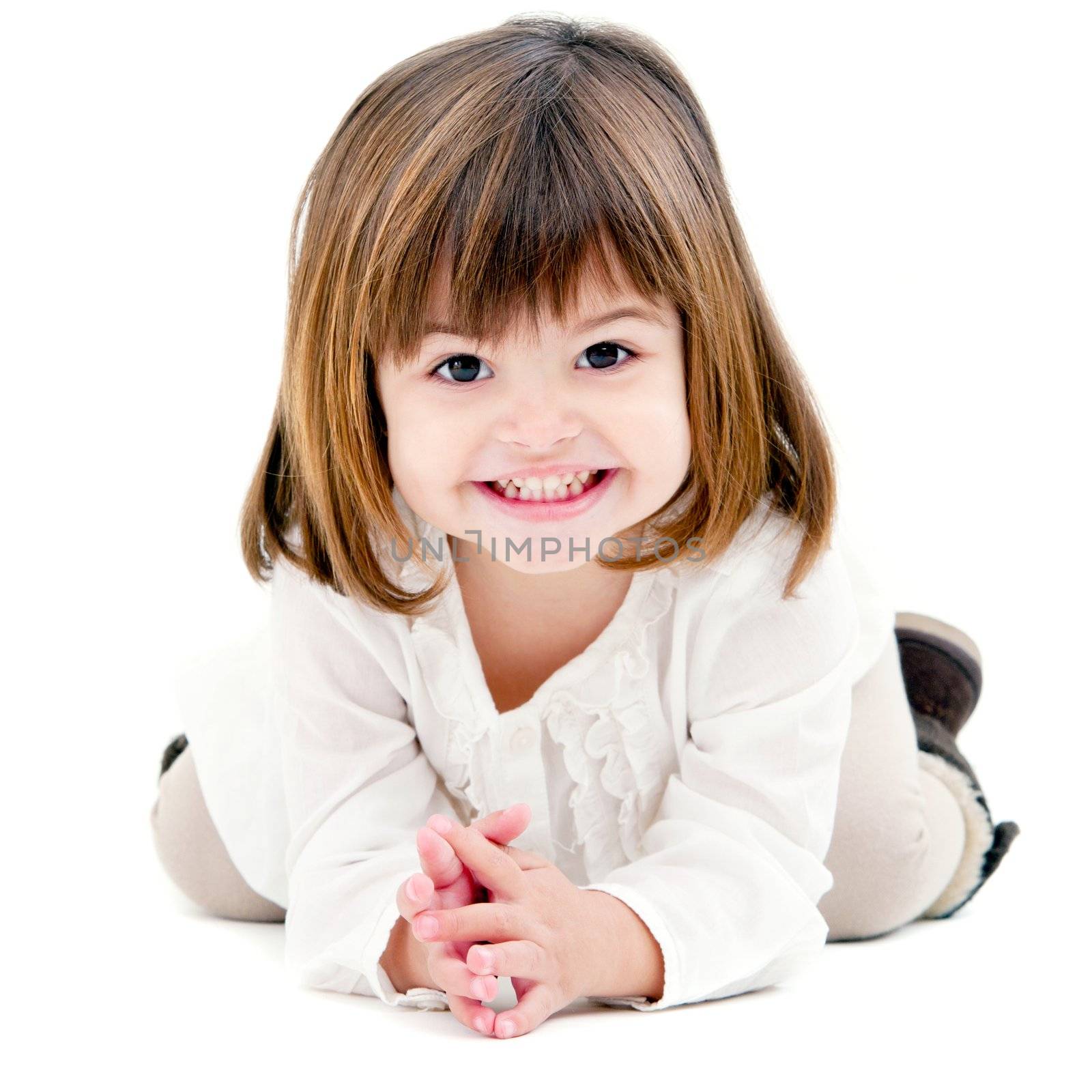 Portrait of cute little girl with toothy smile. Isolated on white background.