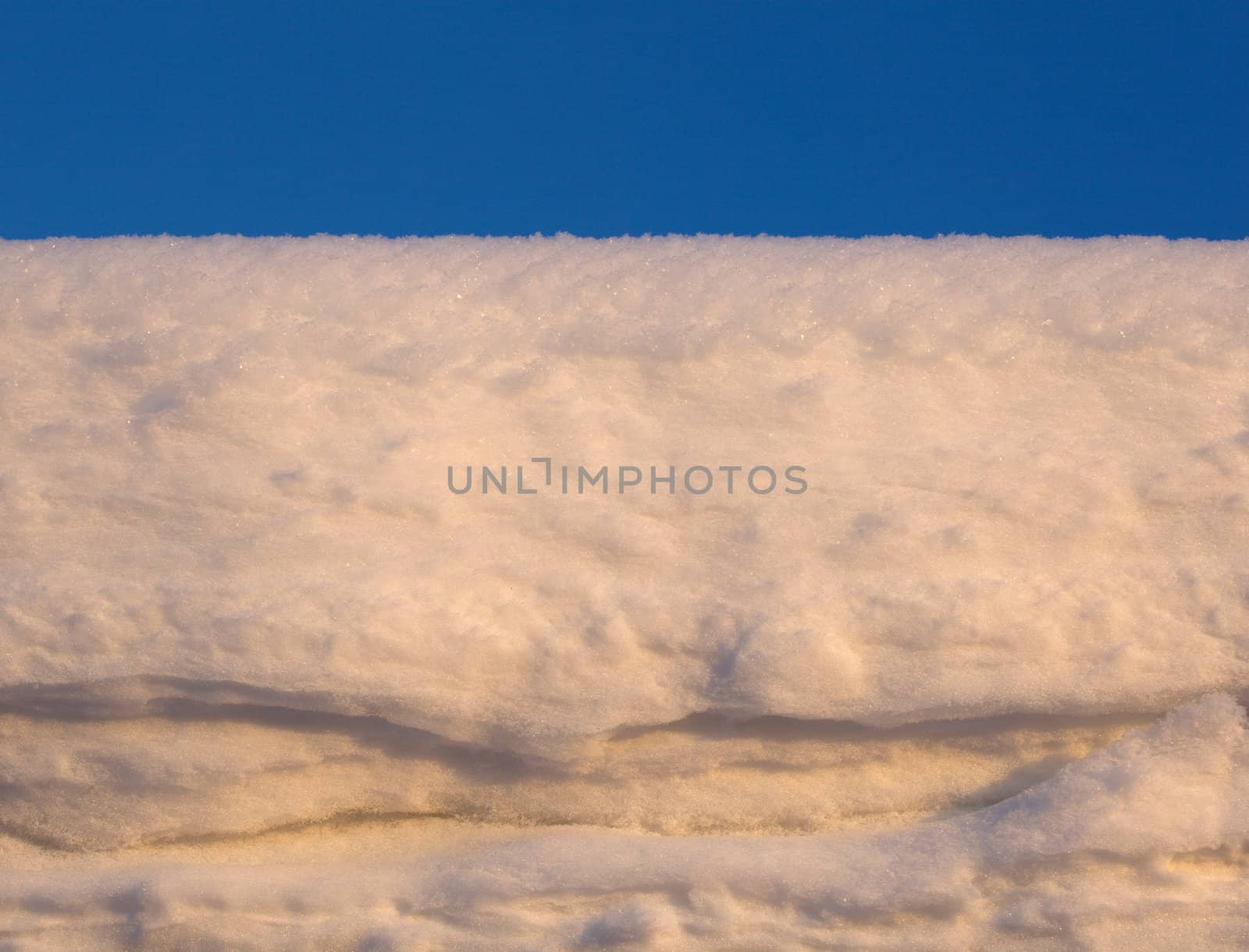 Snow white against the blue sky. Winter landscape