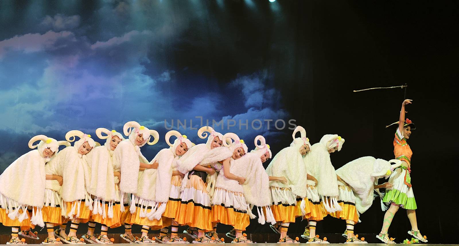 CHENGDU - SEP 26: chinese ethnic dancers of Yi nationality perform on stage at JIAOZI theater.Sep 26,2010 in Chengdu, China.