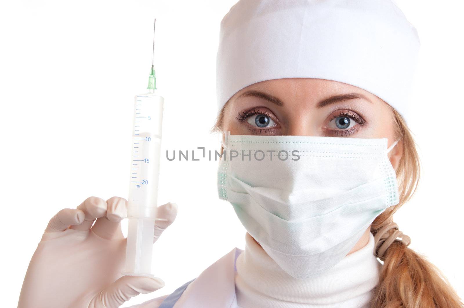 Medical doctor woman in mask and syringe over white