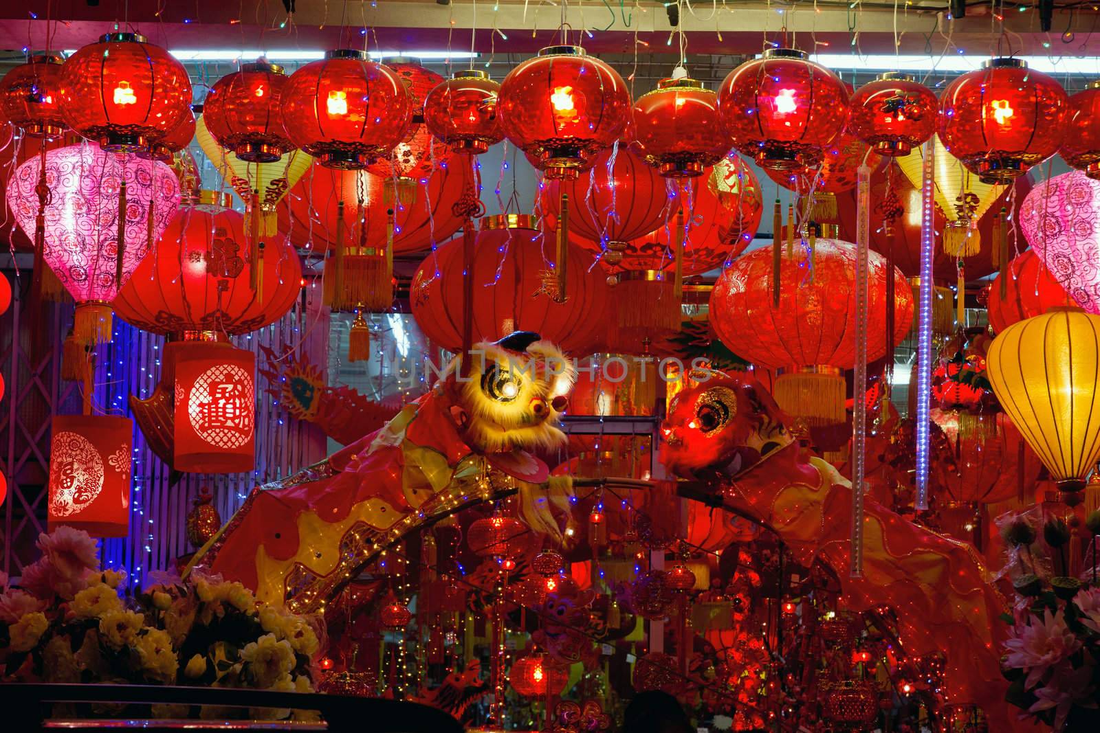 Storefront Displays of Chinese New Year Lanterns and Lion Dance along Street in Chinatown