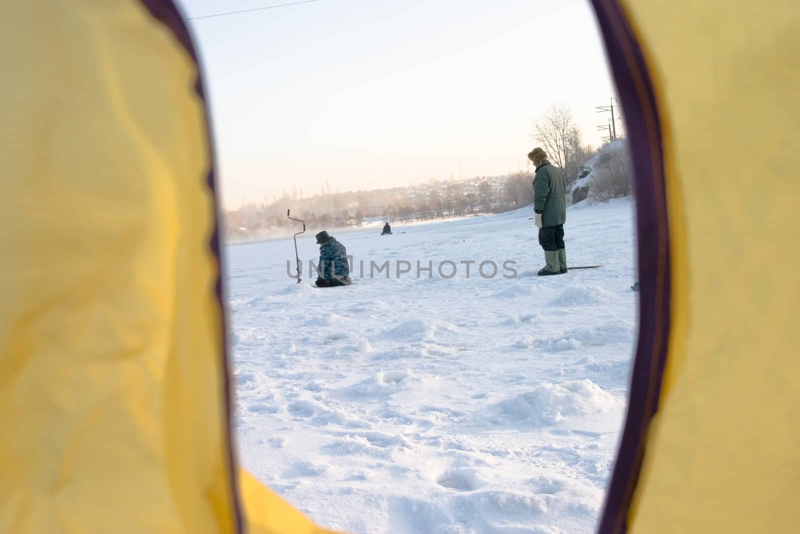 The fisher on winter fishing pending a biting