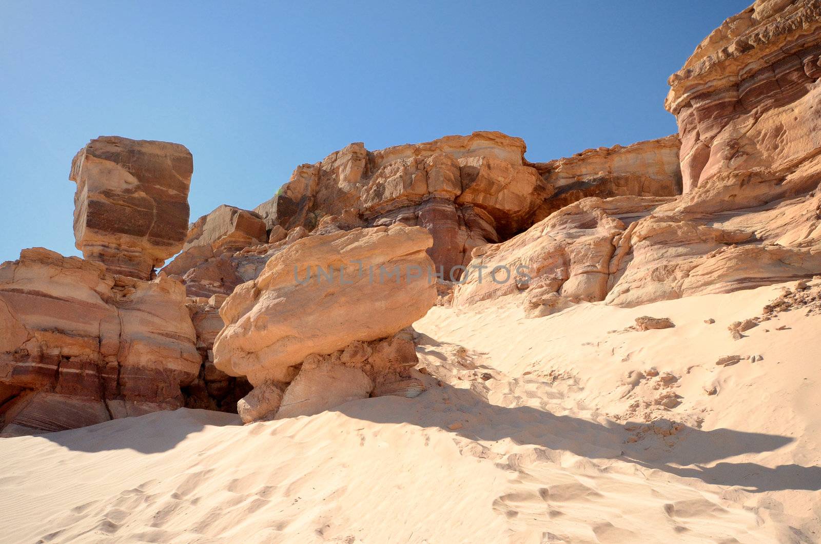 Scenic weathered orange rock in stone desert under sky