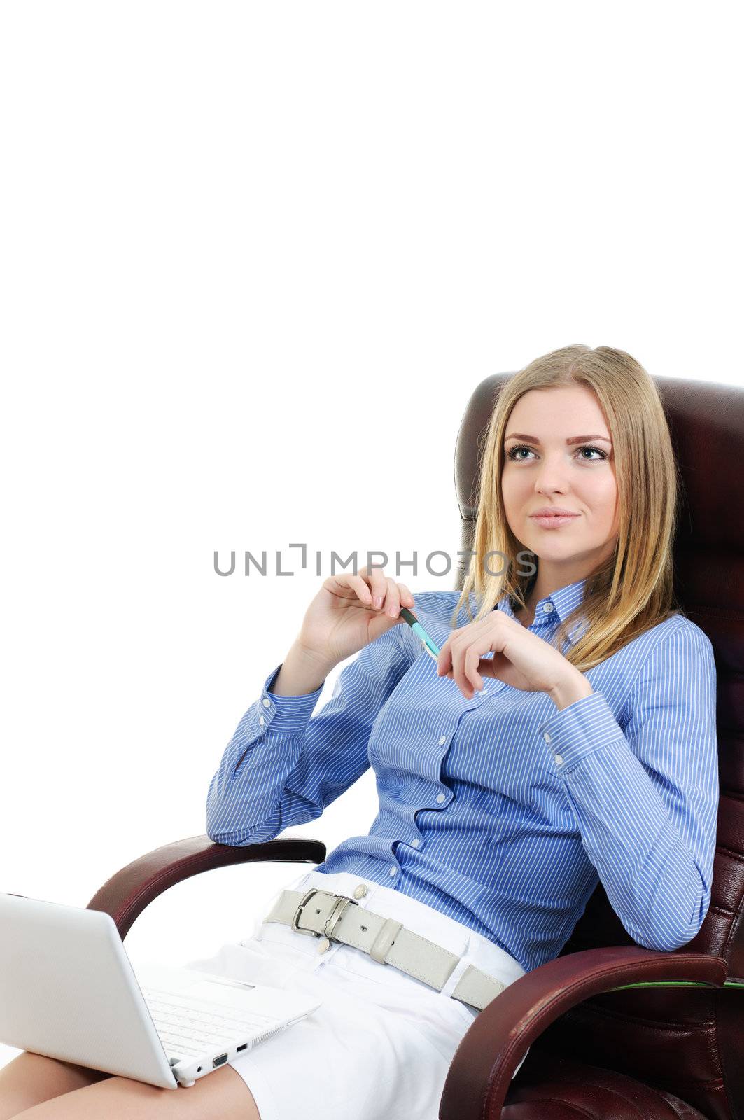 beautiful young girl working for a laptop in a chair