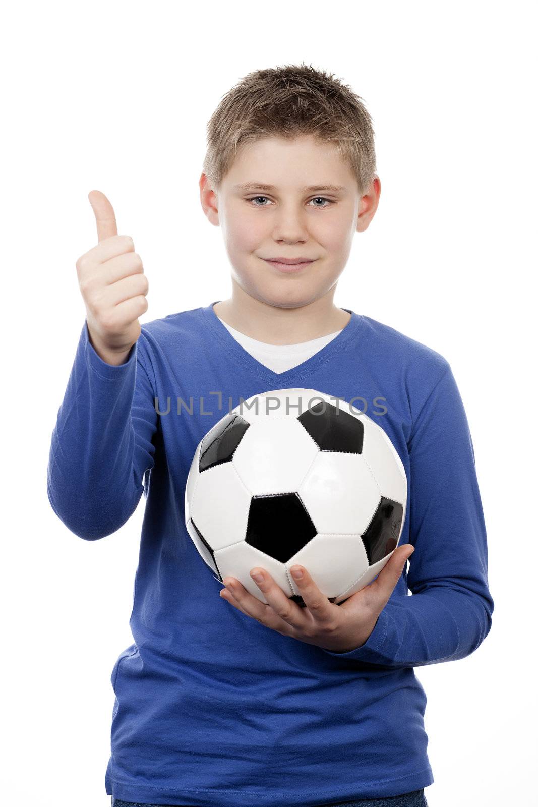 Cute young boy holding a football ball