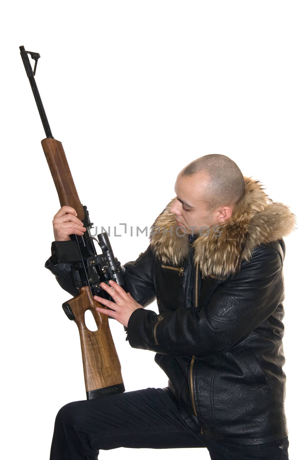 Young the man considers a carbine with an optical sight