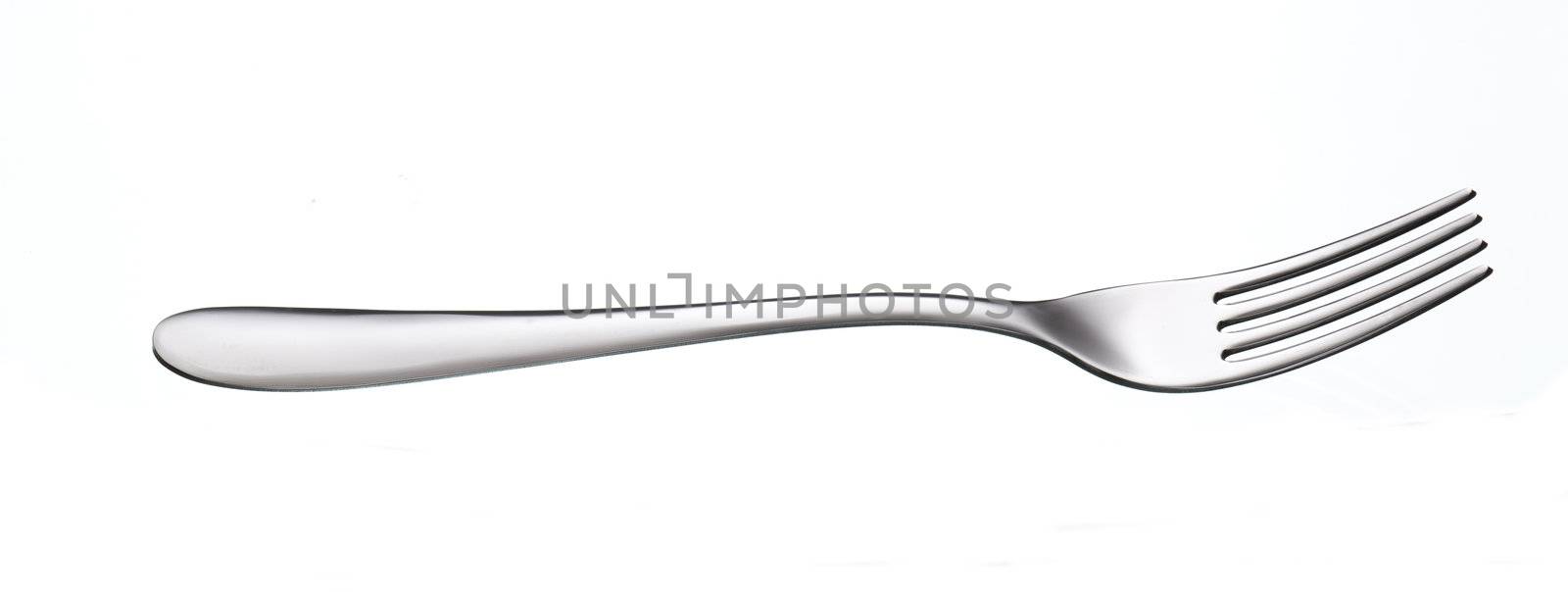 shiny silver fork over white background with reflection