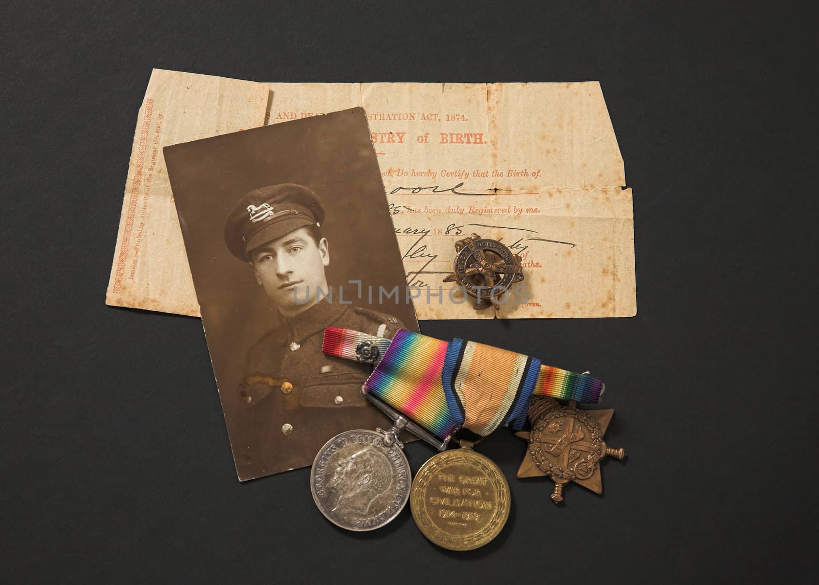Great War memorabilia - photograph medals and birth certificate