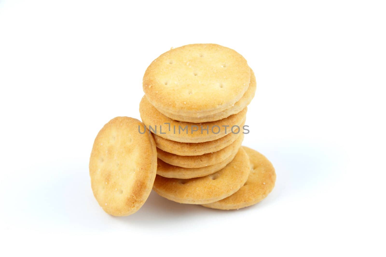 A pile of salt crackers isolated on white.