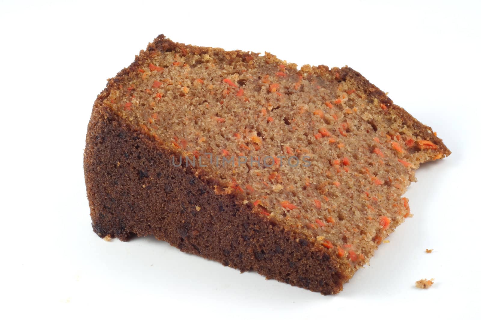 A slice of carrot cake isolated on a white background.