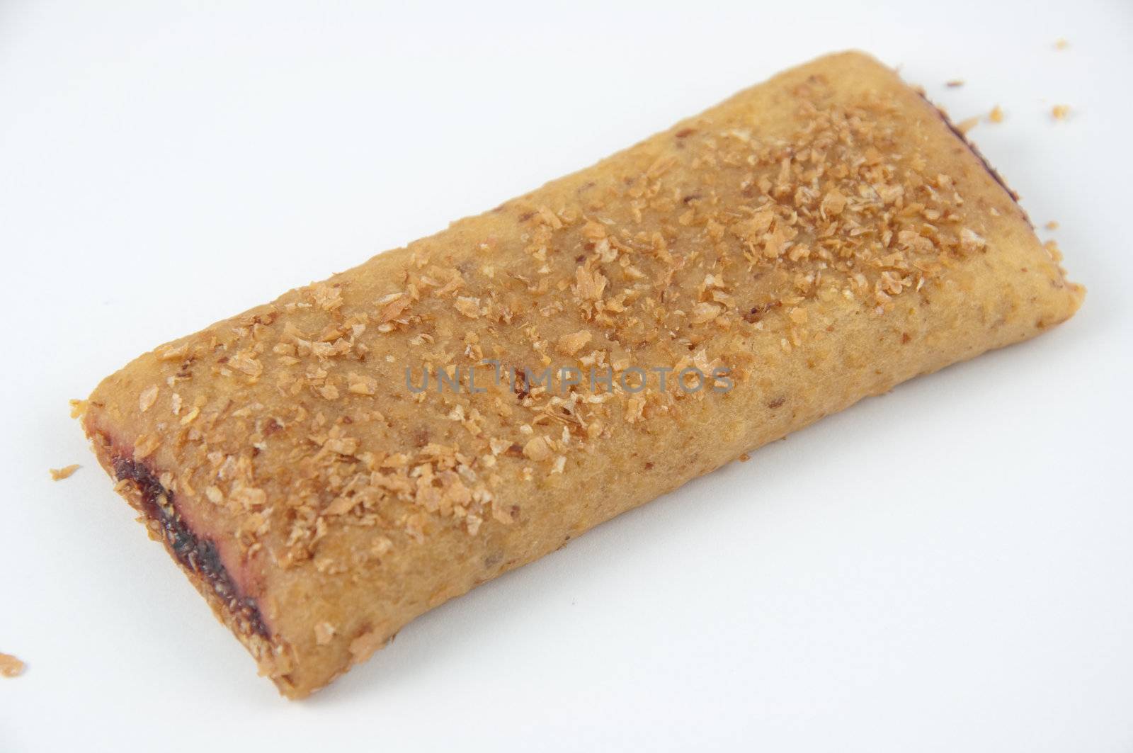 A raspberry cereal bar isolated on white.