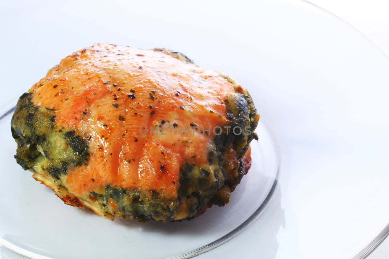 Baked salmon stuffed with spinach.