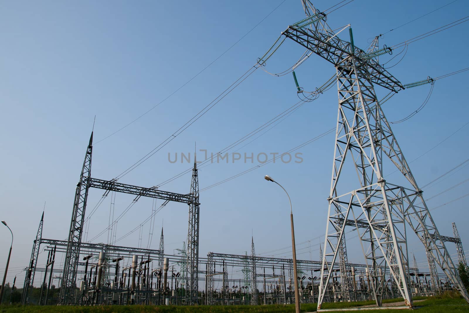 high-voltage line and substation on blue sky background