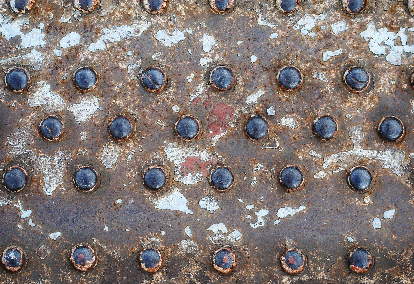 Used grungy goffer iron board with buttons as background