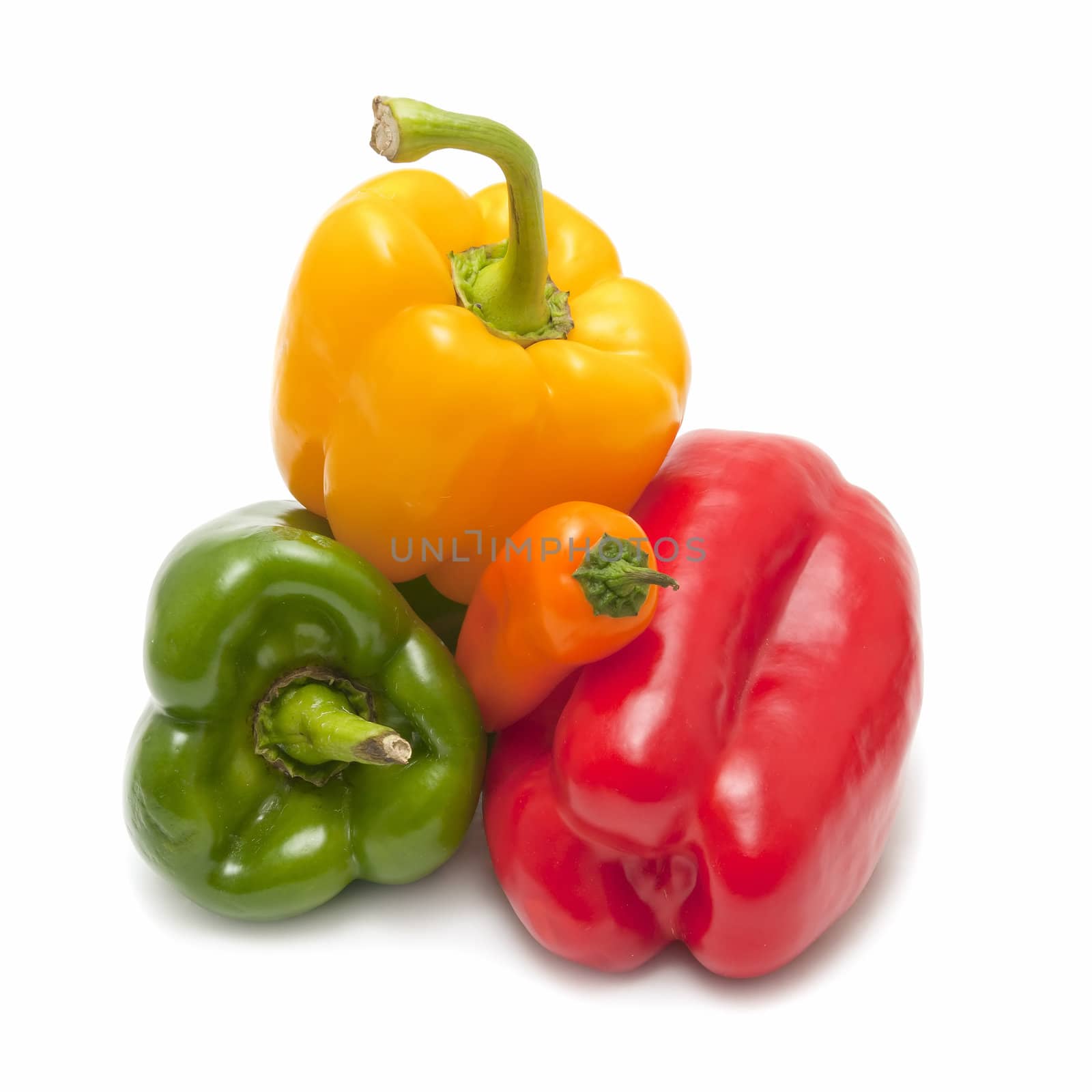 yellow pepper, red and green on white background