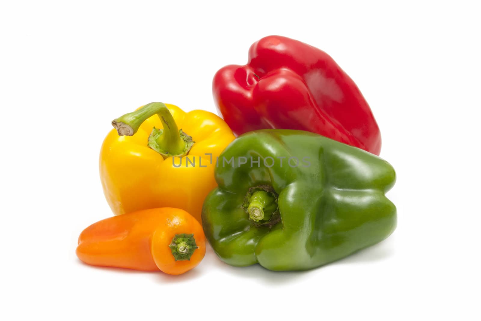 yellow pepper, red, orange and green on white background
