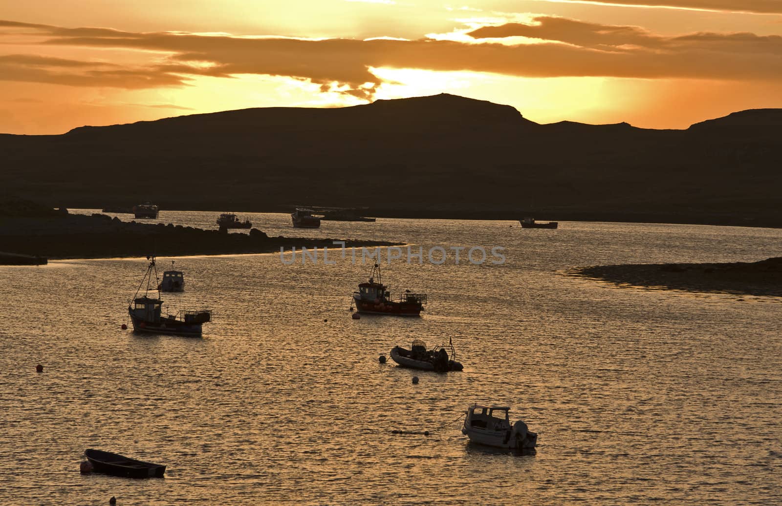 sundown in scottish bay with some small ships