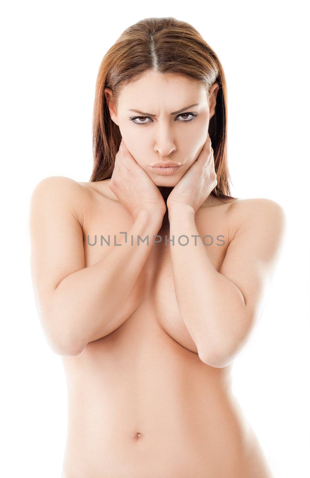 Beautiful naked female with hands on breasts, making sulky face